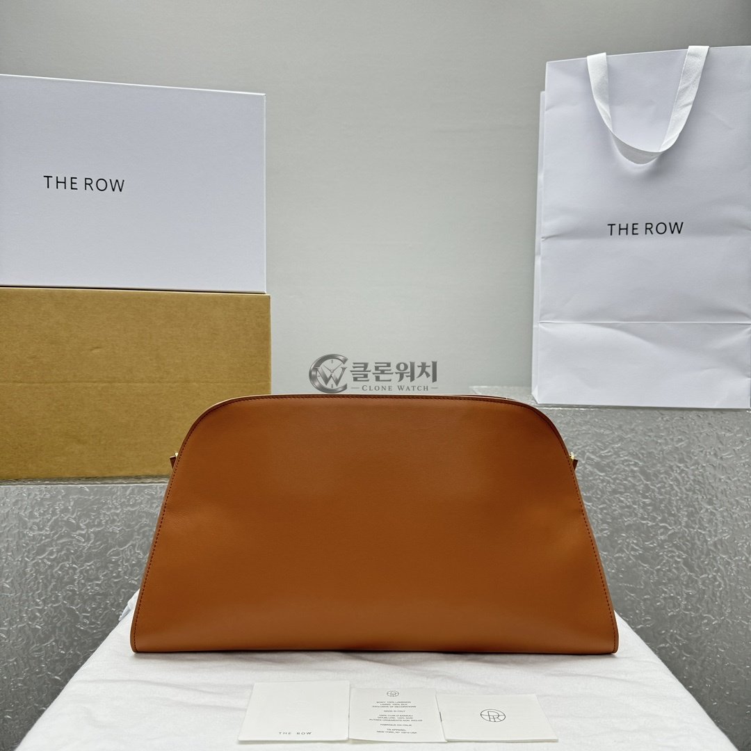 THE ROW Curved Leather Clutch – Cognac Brown