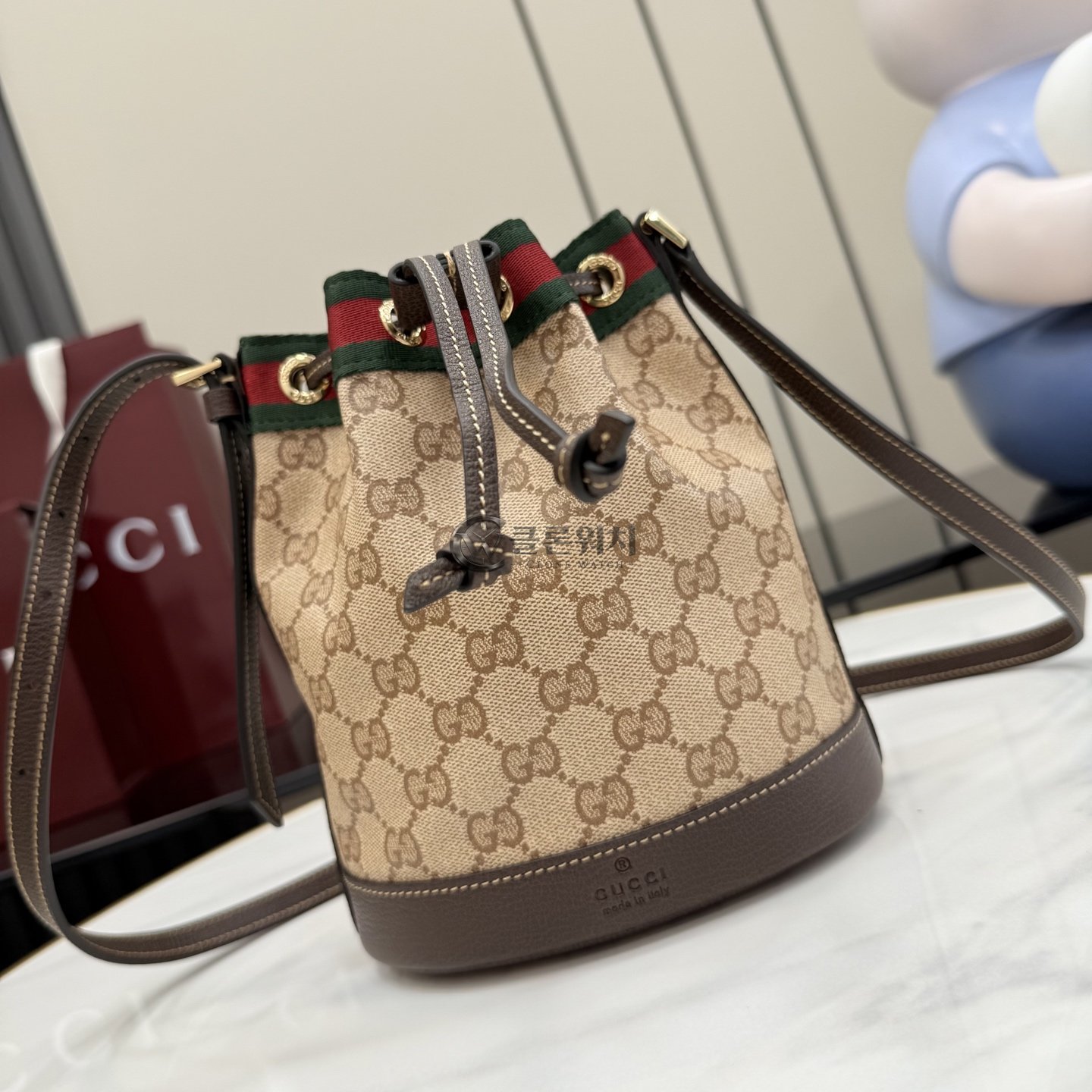 구찌 GUCCI Web Stripe Mini Bucket Bag in Sand and Brown GG Canvas